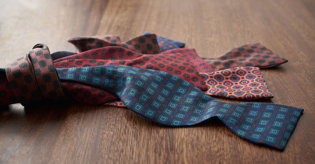 Bow Ties laid out on wooden table