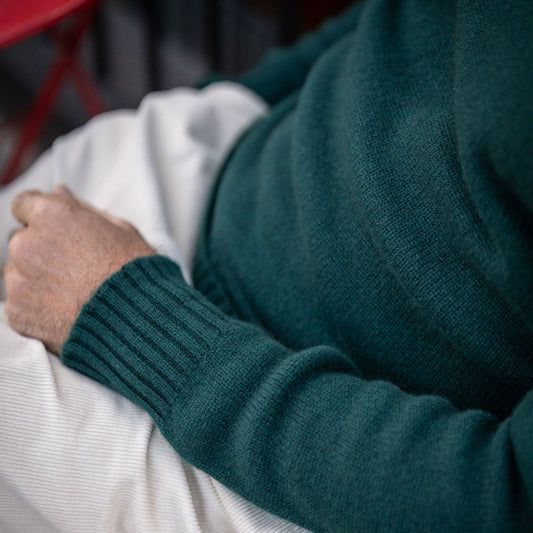 Detail of Cashmere roll neck jumper in Bottle green
