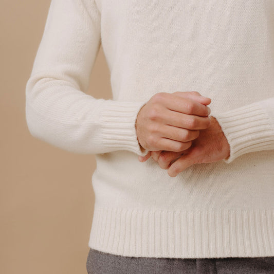 Sleeve and cuff detail on Cashmere Roll Neck Jumper in Undyed White