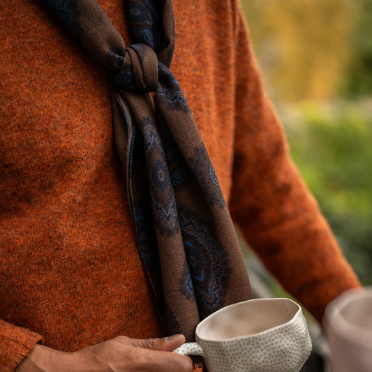 Brushed Shetland Crew Neck sweater in Burnt Orange worn with brown fine wool scarf.