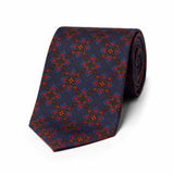 Authentic madder silk tie in blue with bold geometric design
