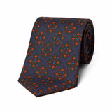 Authentic madder silk tie in deep purple and chestnut with bold geometric design
