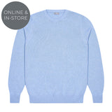 Light blue sweater on a white background with 'Online & In-Store' text.