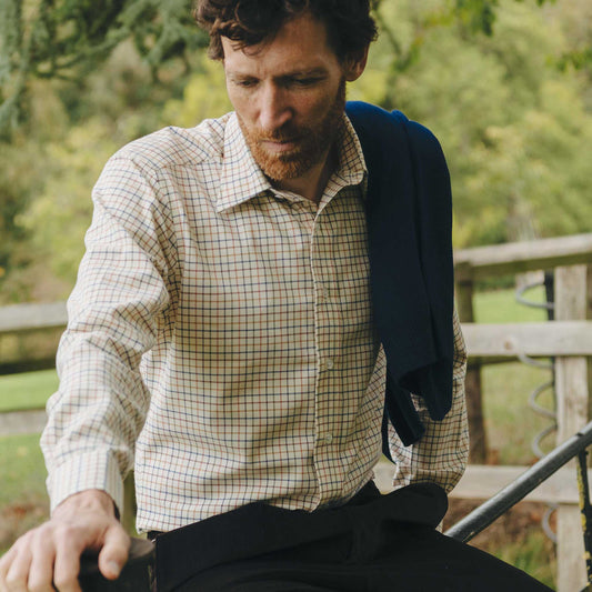 Man sitting outdoors with a natural background