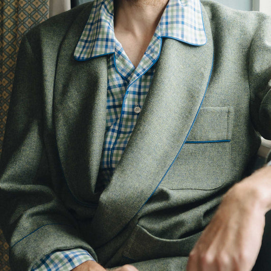 Male model detail shot of tweed dressing gown in green with checked pyjama shirt underneath