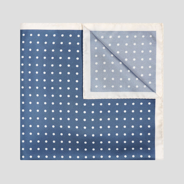 Butcher blue and ivory silk twill pocket square with a classic polka dot pattern and elegant contrast border.