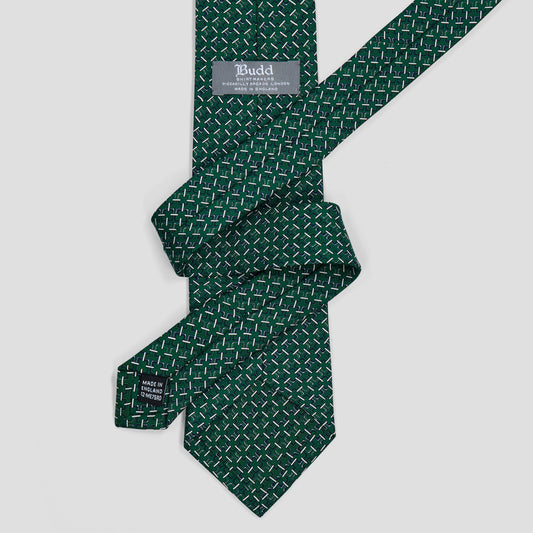 Emerald green silk tie with a geometric Art Deco trellis print, hand-made in England with an 8.5cm blade.