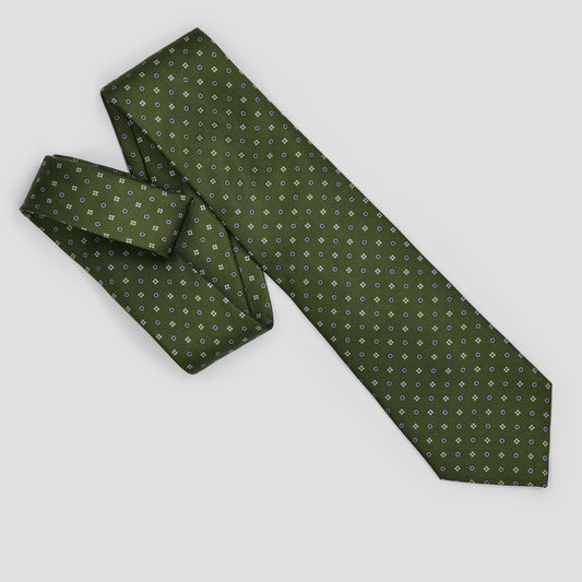 Olive green silk tie with navy and pale blue geometric floral dot pattern, handmade in England with an 8.5cm blade.