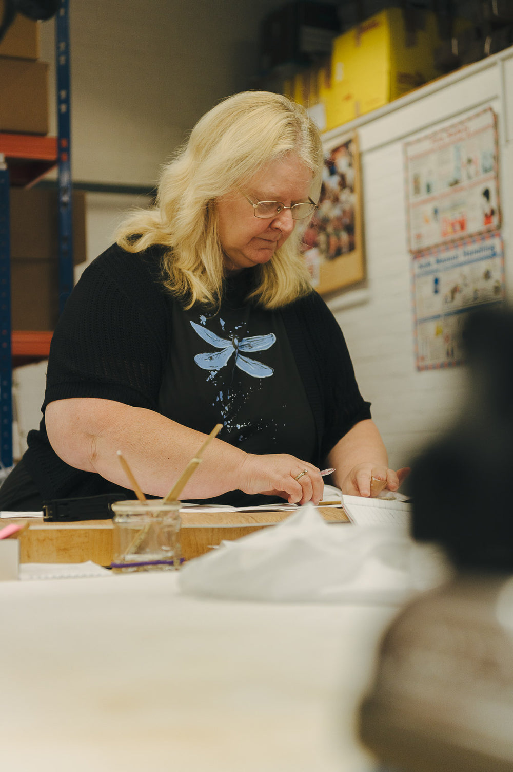Woman machinist working on a shirt