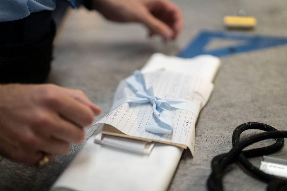 Cloth bundle of shirt fabric tied with blue ribbon