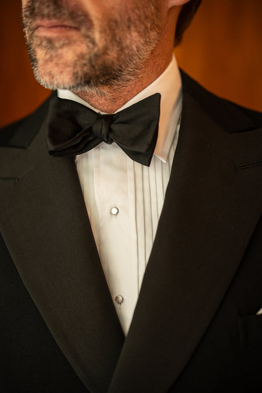 Model wearing Kirby Allison x Budd White 1/4 pleat cotton poplin evening dress shirt 