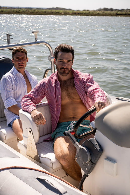 Cranberry linen shirt with green floral swim shorts