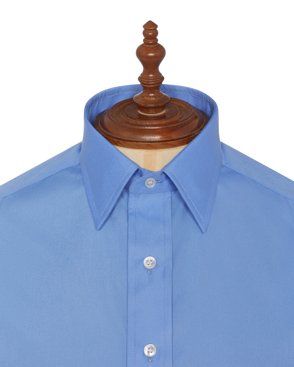 Blue dress shirt on a wooden mannequin with a white background