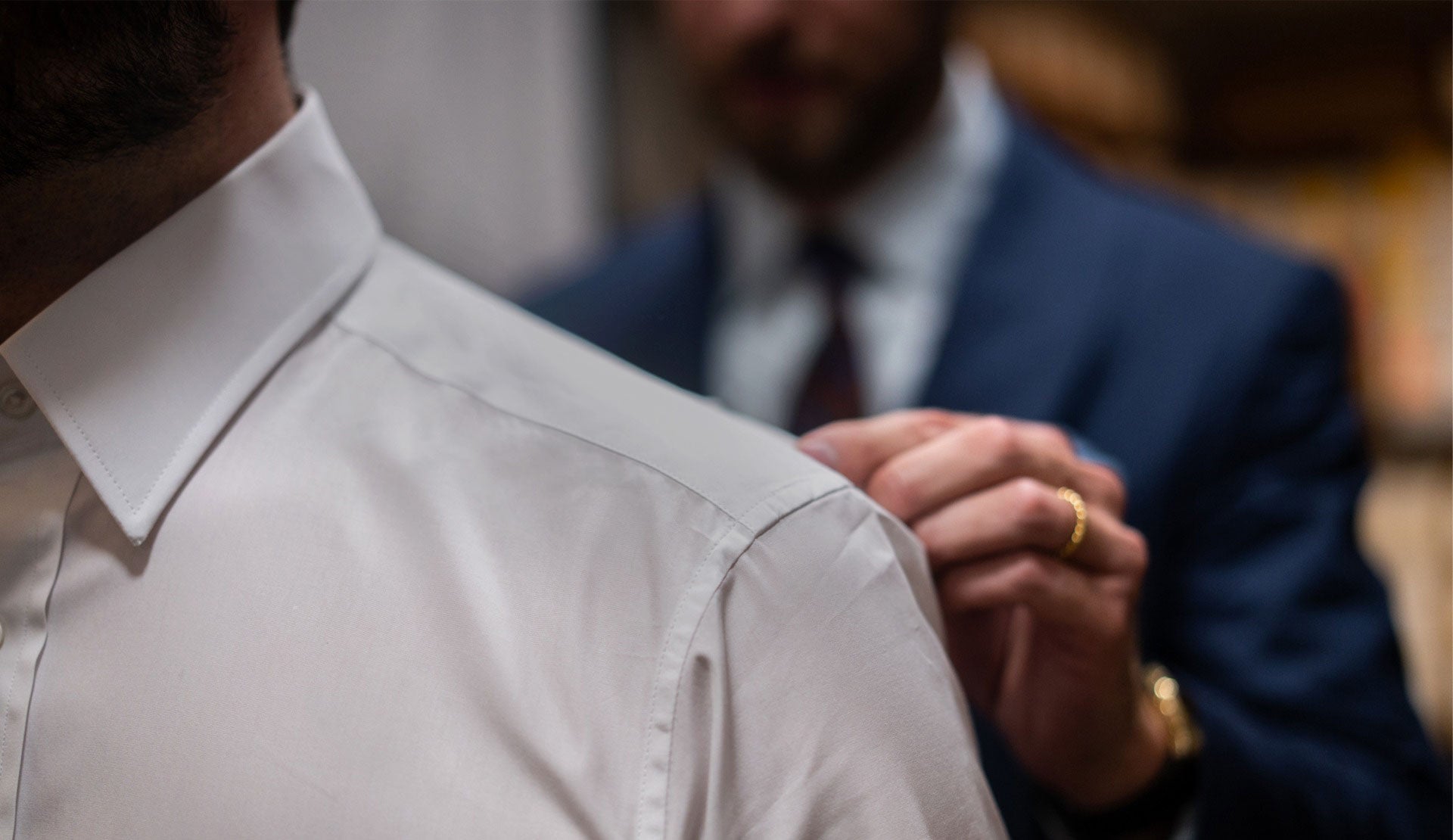 Man being measured up for made to measure shirt