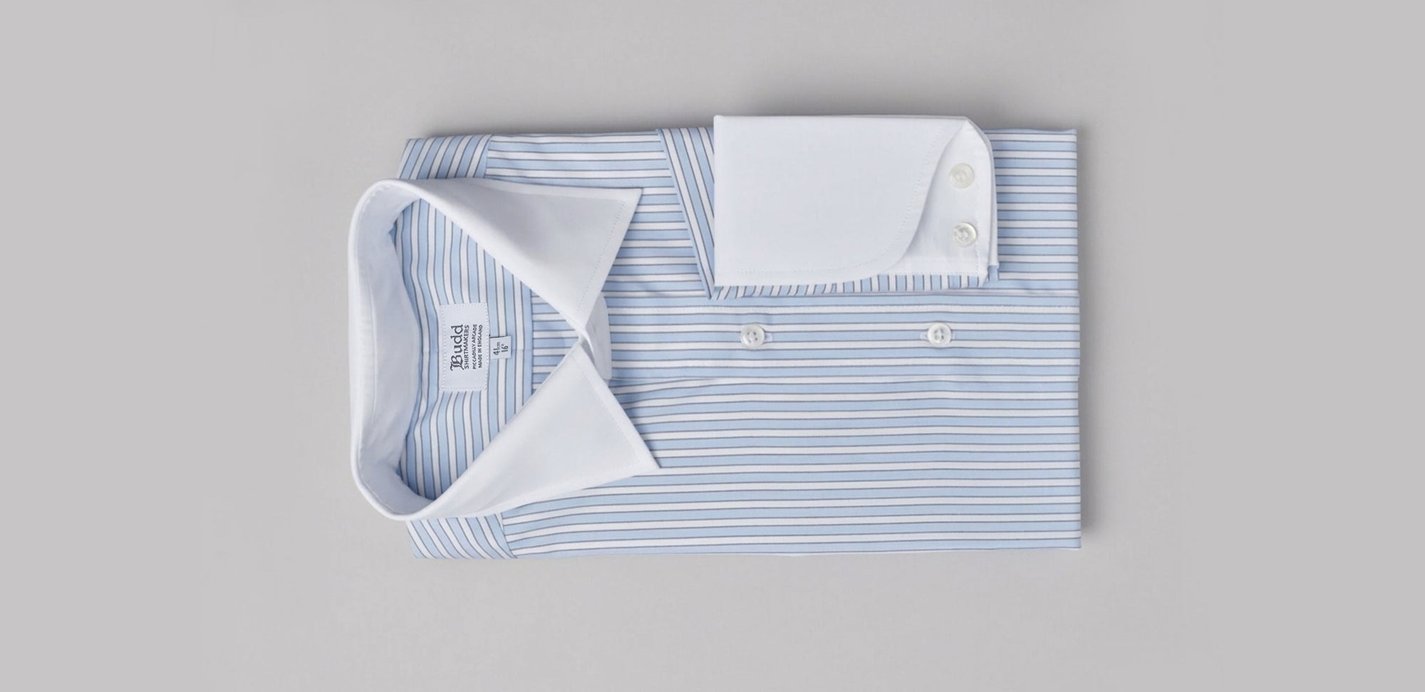 Striped blue shirt with white collar and cuffs