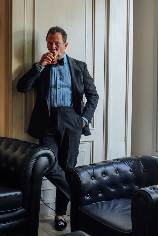 Matt Hranek wearing his WM BRown x Budd washed blue denim pleated front dress evening shirt with cocktail cuff 