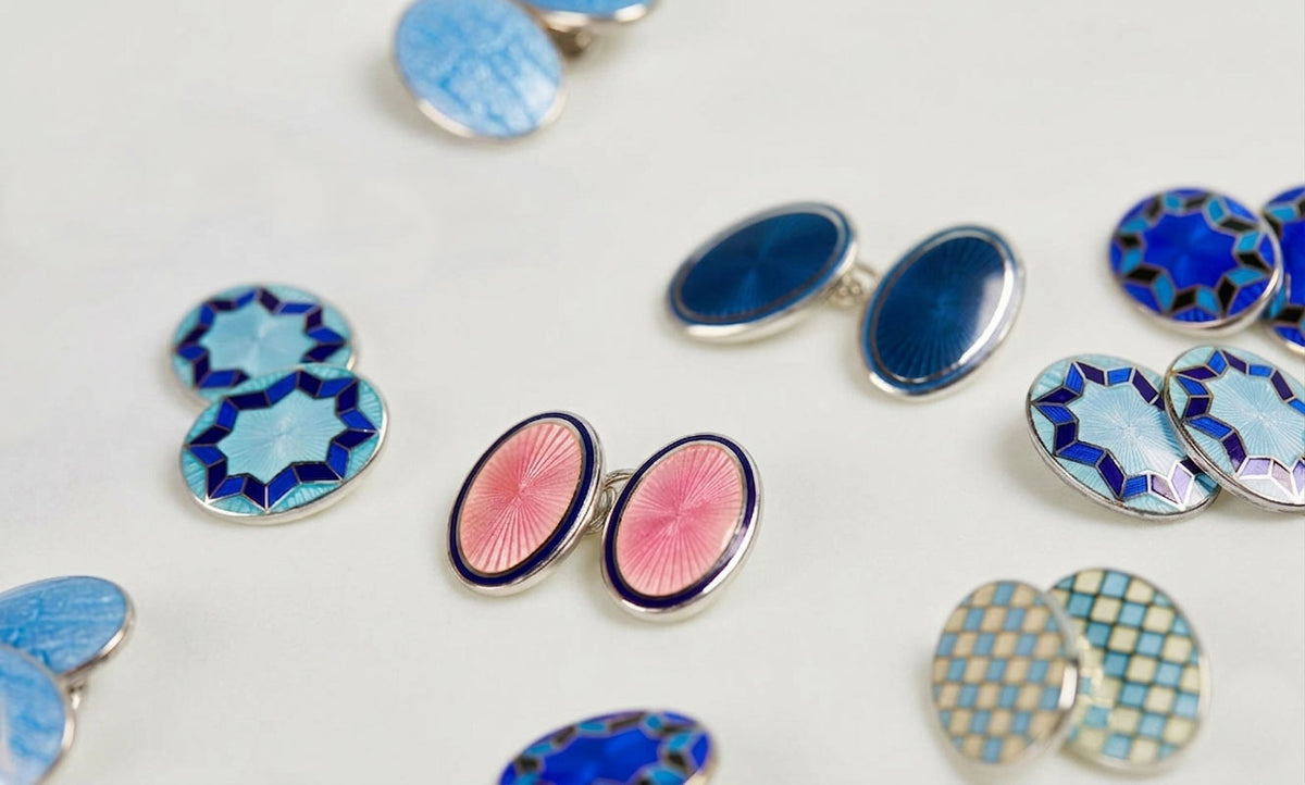 Colorful enamel cufflinks on a light background
