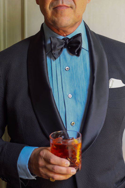 Detail of WM BRown x Budd washed blue denim pleated front dress evening shirt 