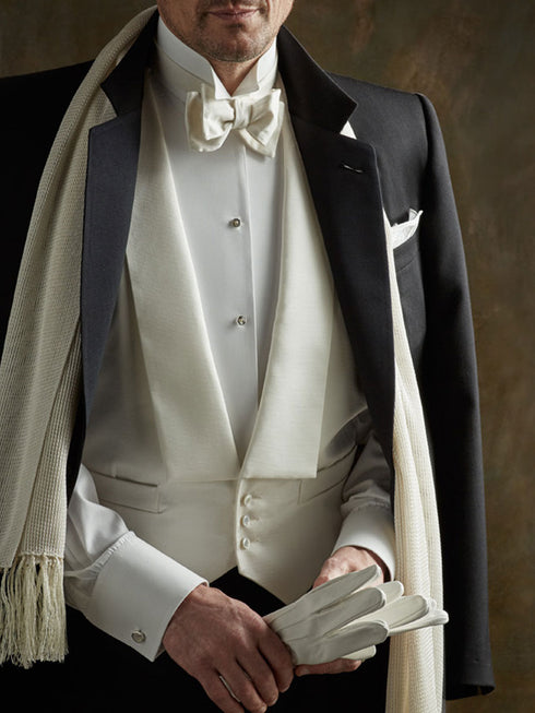 White tie outfit with bow tie, vest, stiff bib shirt, studs and gloves