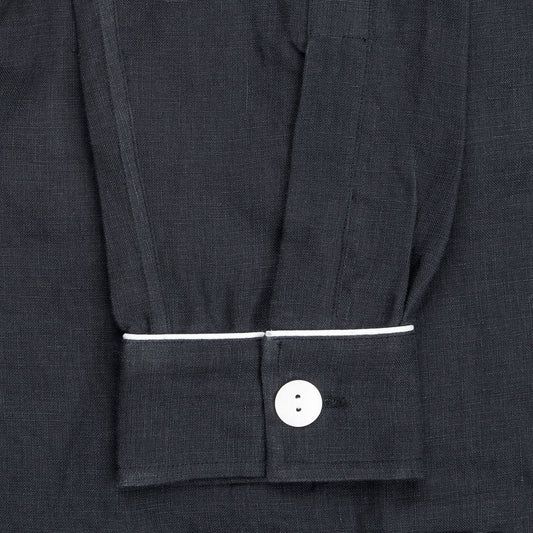 Sleeve detail on women's navy linen pyjamas with white piping