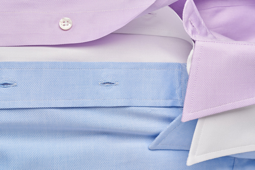 Blue, white and lilac shirt laid out in detail image