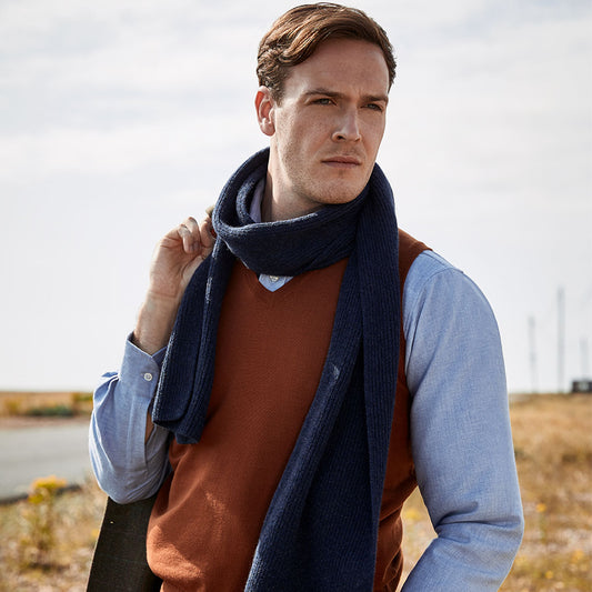 Model wearing Plain Wool Slip Over Jumper in Cayenne which blue knitted scarf
