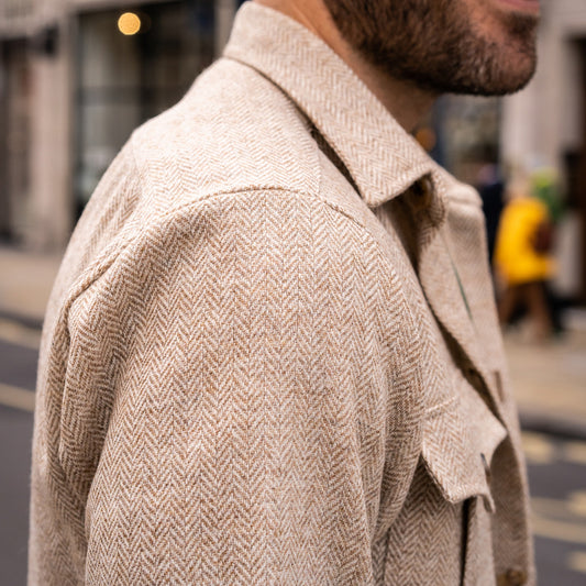 Herringbone Wool Button Cuff Safari Shirt in Natural on model collar