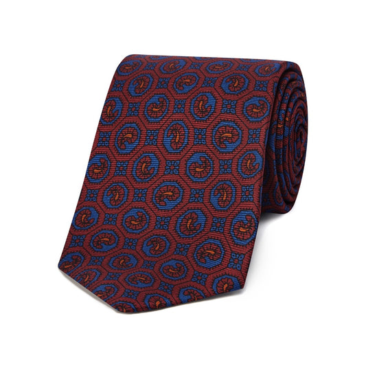 Madder silk leaf emblem tie in red and blue