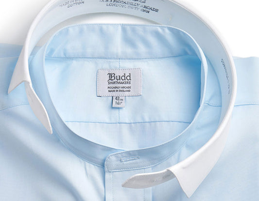 Close up of neckband dress shirt in sky blue with detachable collar