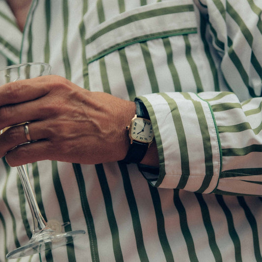 Cuff detail on WM Brown x Budd Cocktail stripe cotton poplin pyjamas in olive and white